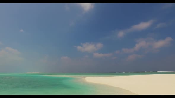 Aerial drone texture of relaxing shore beach break by blue sea with clean sandy background of a dayo