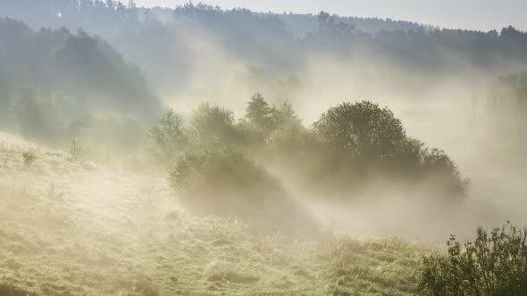 Stunning sunrise over valley with beautiful mist in autumn, timelapse, 4K alt