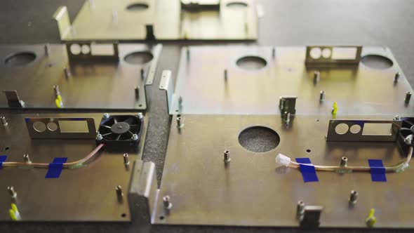 Slider Shot of a Blank Metal Components in Workshop Laboratory