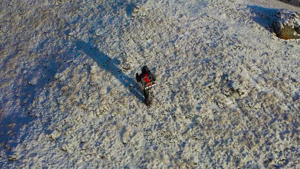 A Lone Hiker Walks Along the Top of a Mountain Range