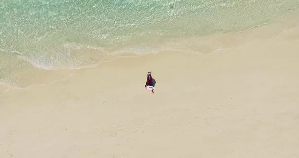 Aerial View of A Woman on The Beach Lying and Sunbathing on The Beach