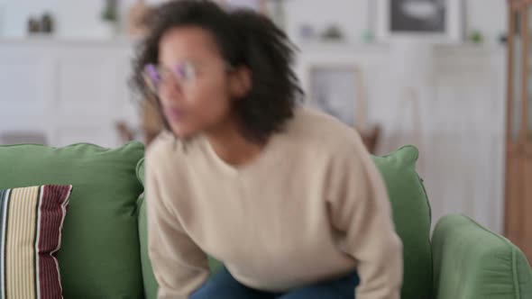 Young African Woman Standing Going Away on Sofa, 