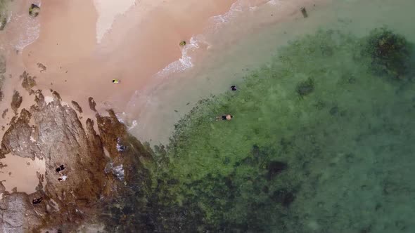 Small Tropical Beach with Rocky Point Aerial