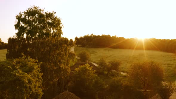 Rural Countryside Landscape with Bright Evening Sun Rays