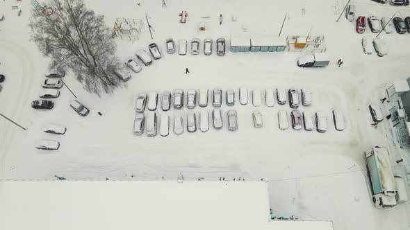 Cars in the Parking Lot After a Blizzard are Abundantly Covered with Snow