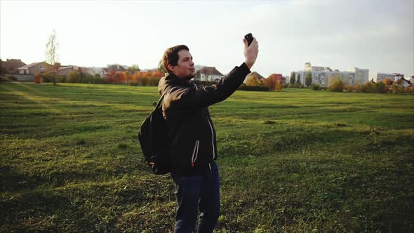 Young Man in Black Jacket Making Selfie Outdoor Slow Motion