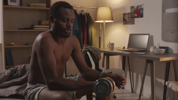 Man Doing Bicep Curl at Home