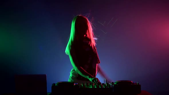Attractive, Smiling Dj Girl in Sexy Clothes, Flipping Hair, Hands Up, Enjoy It, Using Headphones
