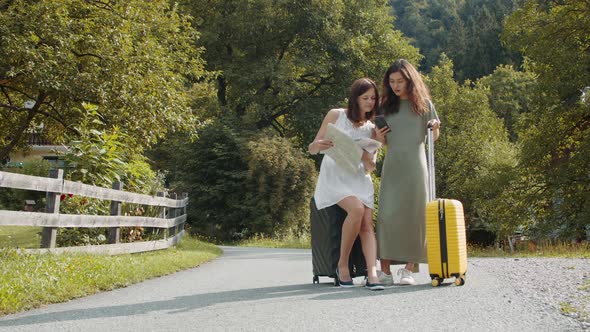 Tourists with Suitcases Searching a Booking Address