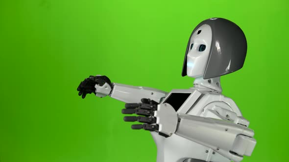 Robot Answers the Questions and Gestures with His Hands. Green Screen. Side View