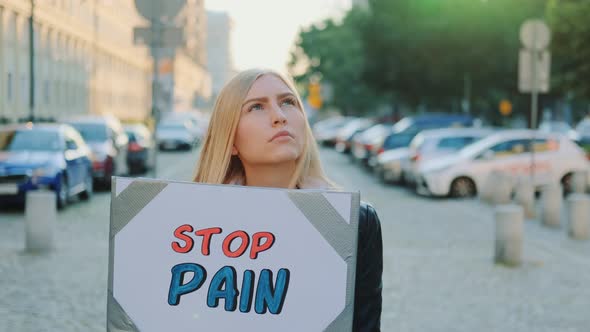 Woman Protesting To Stop Pain By Holding Steamer