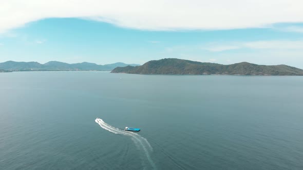 One motorboat roaring towards Coral Island, Thailand. Paradisiac tropical holidays