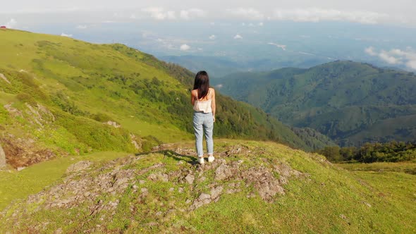 Gomismta mountain view with woman enjoying landscape