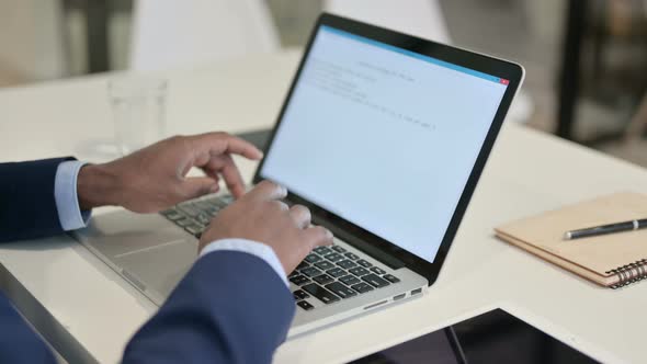 Businessman Typing on Laptop in Office Close Up