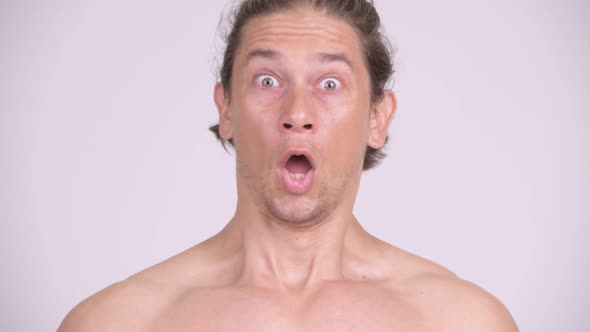 Face of Stressed Muscular Shirtless Man Looking Shocked