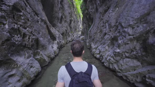 The free man is walking in the canyon.