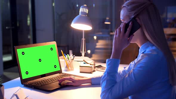 Businesswoman with Green Screen on Laptop at Night 17