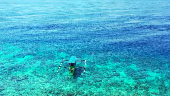 Aerial flying over nature of relaxing shore beach lifestyle by transparent ocean with white sand bac