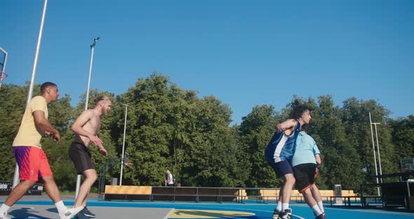 Basketball Players Score Ball and Enjoy Victory in Fair Game