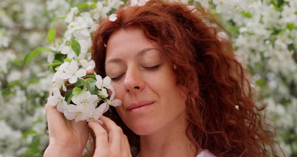 Redhead Woman in the Garden