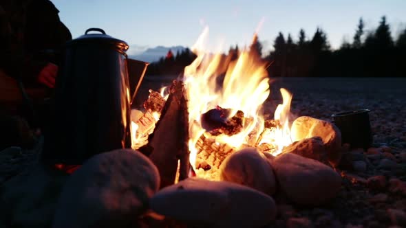 Slow motion shot of a bonfire at dawn