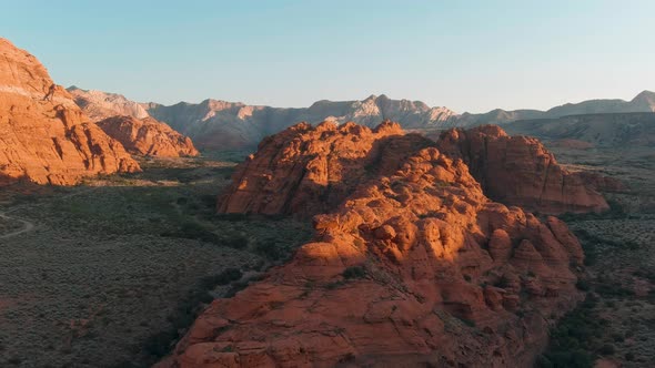 Aerial shot lowering in one of Utah's many state parks featuring arid terrain.