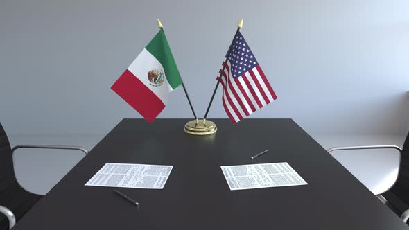 Flags of Mexico and the United States on the Table
