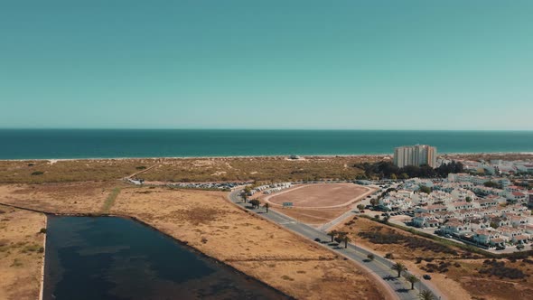 Aerial panorama view of Altura Town with sandy beach and blue ocean in background