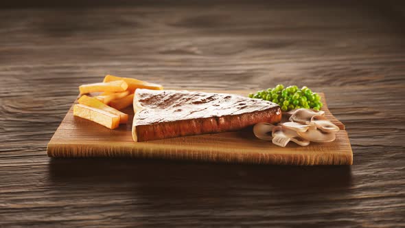 A tasty dish at the restaurant. Steak with french fries sprinkled with salt.