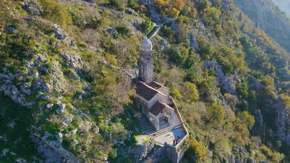 Aerial Shot of the Christian Church on a Way to the Top of the Mountain Where St