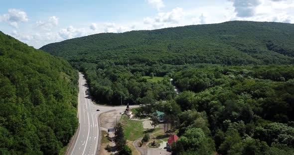 Aerial View of a Rural Highway Between Mountains