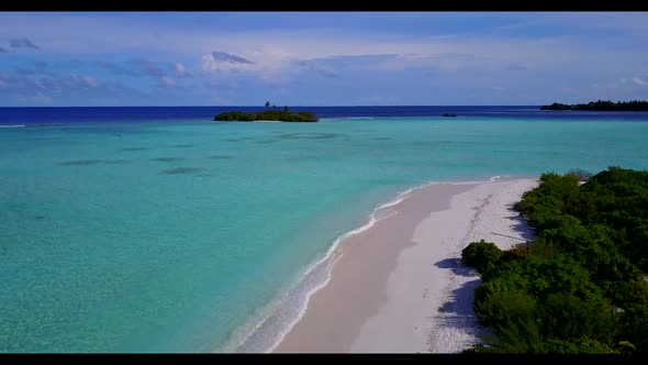 Aerial texture of paradise coast beach time by blue green sea and white sandy background of a daytri