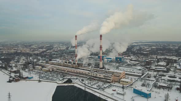 Industry pipes pollute the atmosphere with smoke. Smoking factory chimneys