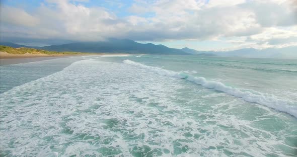 Waves reaching the sea shore 4k