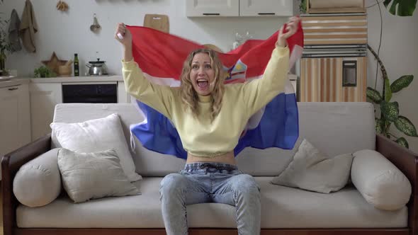 Woman Sports Fan at Home with the Flag of Croatia