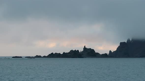 POV WS Rocky coast of Half Moon Island at sunset / Antarctica