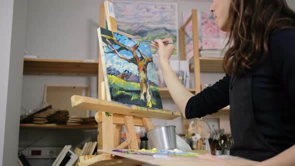 Young Painter Is Going To Finish Landscape Painting