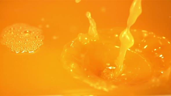 Super Slow Motion Orange Juice Pours with a Stream