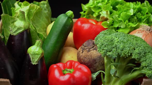 A Box Full of Fresh Vegetables on a Dark Background Wooden Vintage Table