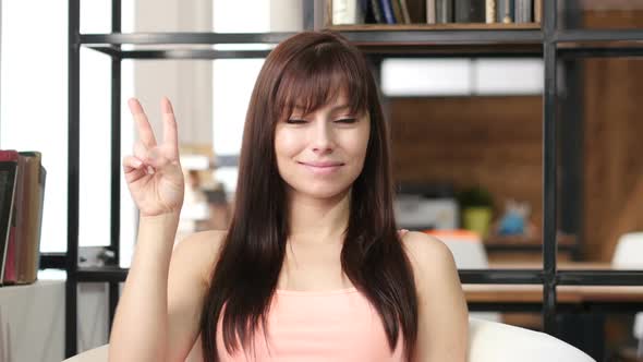 Woman Showing Victory Sign, Indoor Office