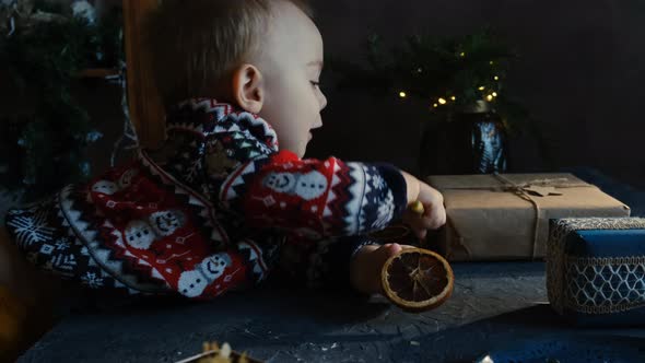 Baby Playing with Christmas Lollypop at Home