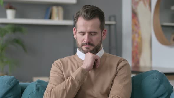 Portrait of Man Taking Nap at Home