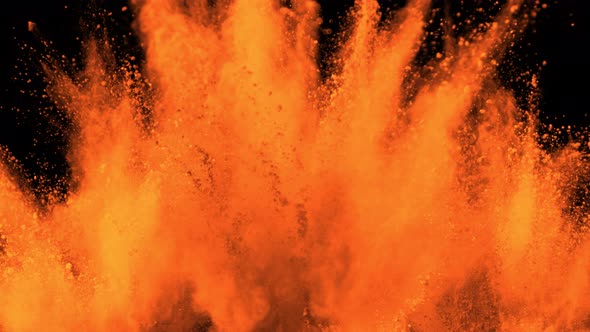 Super Slowmotion Shot of Orange Powder Explosion Isolated on Black Background at 1000Fps.
