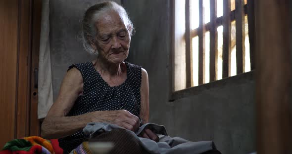 Elderly Woman Sewing