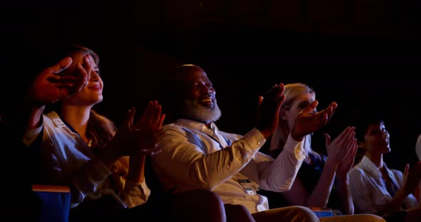 Multi-ethnic business people applauding in business seminar at auditorium 4k