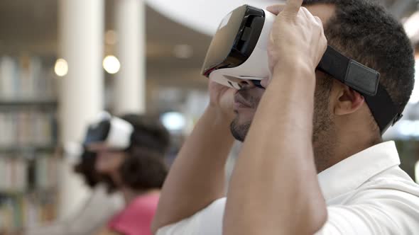 Closeup Shot of Smiling Young Man Wearing Virtual Reality Glasses