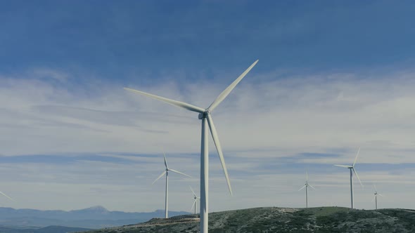 Wind turbines, renewable energy on a green hill. Wind farm