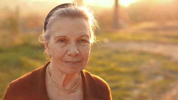Happy Senior Woman on Sunset