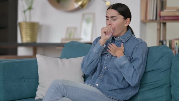 Sick Latin Woman Coughing on Sofa