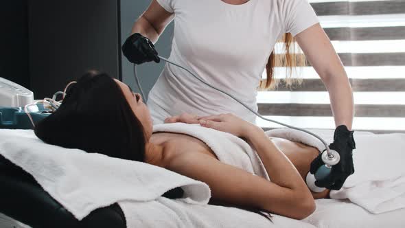 Young Woman on Electric Massage Session